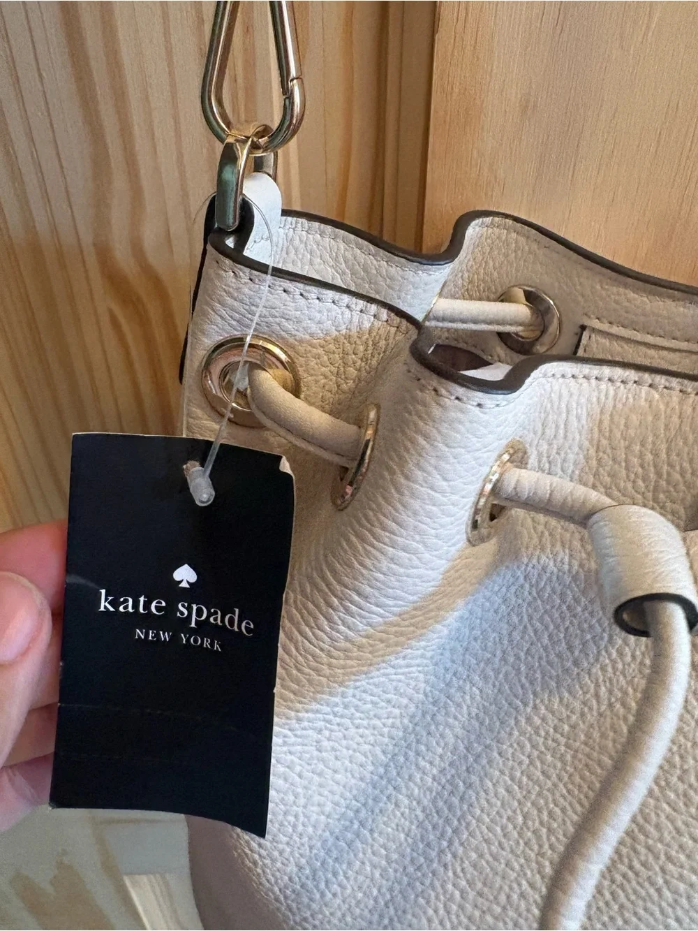 kate spade Cream Pebbled Leather Drawstring Crossbody with Striped Strap